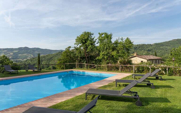 private swimming pool with sunbathing area